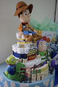 a cake made to look like a toy story book character sitting on top of it