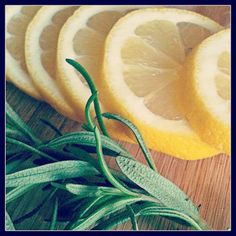 sliced lemons and sage on a cutting board