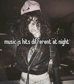 a girl wearing a hat and jacket with the words music is his different at night