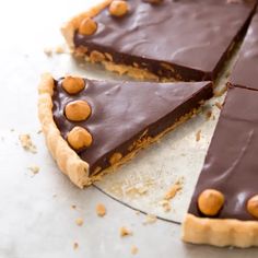 there is a chocolate pie with nuts on it