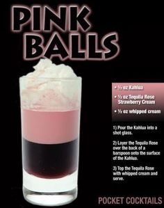 a pink and black drink in a tall glass with whipped cream on the rims