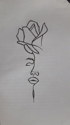 a black and white drawing of a rose on a sheet of paper with the word love written in it