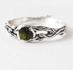 Ring Details- Stone- Natural Moldavite from Czech Republic Metal- 925 Sterling Silver Stone Dimension- 7 mm Round Cut Type - Round ♥ What is Moldavite? Moldavite is a mysterious green glass stone, classed in the tektite family and found only in the Czech Republic. An ancient meteorite impact occurred on our planet about 15 million years ago, which gave birth to a gemstone with many legends, myths, and secrets. ♥ Benefits of Moldavite? Moldavite is a mystical stone that promotes spiritual transformation. It's known for its unique ability to immediately open a portal to the divine. Said to be a stone of metaphysical healing, Moldavite brings about elevated energy levels and inner peace. In recent years, the Internet has exploded with cheap and completely fake Moldavite. The market for this m Metaphysical Healing, Meteorite Ring, Rings Statement, Statement Rings, Jewelry Rings, Gems, 925 Sterling Silver, Etsy Accessories, Accessory Gift