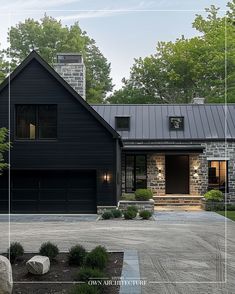 a black house with stone and brick accents