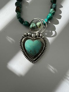 Heart of Love Turquoise Necklace. Decorative setting featuring a beautiful Kingman heart turquoise stone handcrafted in sterling silver. Blue green nuggets stones of Hubei turquoise which are polished enhancing the colors of the stones. This is a one of a kind piece inspired by big love. The necklace measures approximately 18” Sterling silver Pendant and toggle clasp One of a kind. You will receive the necklace pictured. Heart Of Love, Hubei Turquoise, Cowgirl Style Outfits, Heart Pendants, Turquoise Heart, Layered Jewelry, Fabulous Jewelry, Cowgirl Style, Big Love