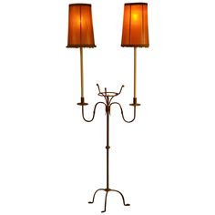 two floor lamps with brown shades on them