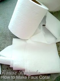 two rolls of toilet paper sitting on the floor