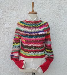 Red Bohemian Knit Sweater, Red Bohemian Top For Winter, Winter Multicolor Knitted Tops, One Size Multicolor Knitted Sweater, One Size Red Knitted Sweater, Red Knitted One Size Sweater, Multicolor Knitted One-size Sweater, Multicolor Knitted Tops For Winter, Multicolor Hand Knitted Tops For Fall