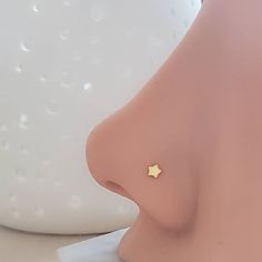 Dainty Star L Bend nose stud, 20g in 316L Surgical Steel, or Plated Gold • T H E • D E T A I L S • • 316L Surgical Steel or Yellow Plated Gold • Star is 2.5mm• Post is 20g• Thoughtfully packaged & ready for gift giving!• Handmade, just for you, in our sunny California Studio• Our 365 Guarantee: Our jewelry is guaranteed for 1 year after purchase date against defects.• Your nose stud is sent in a gloss white jewelry box & our signature "Studio Blue" satin drawstring pouch, (shown in the l Nose Percinings Aesthetic, Cute Nose Studs, Jewelry Wishlist, Jewelry Piercing, Face Piercings, White Jewelry Box, Body Jewelry Piercing