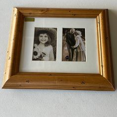 two framed photos are hanging on the wall