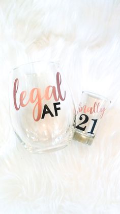 two wine glasses with the words legal af and 21 on them sitting next to each other