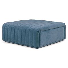 a blue footstool sitting on top of a white floor