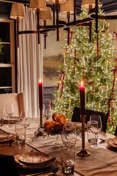 a dining room table set for christmas dinner