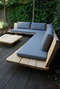 a couch sitting on top of a wooden deck