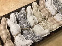 a box filled with stuffed animals on top of a wooden table