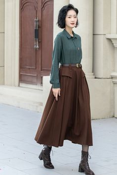 The attention to detail in the construction of this long brown wool skirt is evident in every stitch, show casing the craftsmanship and expertise that went into its creation. With its timeless silhouette and luxurious feel. DETAIL * 50% wool, 50% fiber,nylon, etc. * Fully satiny lining, more nice to the touch body * Two side seam pockets * Elastic waist at back * Long wool skirt * Swing skirt * High waist skirt * Party skirt * For autumn and winter * Belt not for sale * Dry clean only * Lean More about the items From the FAQs on the page bottom MODEL SIZE Bust 85 cm(33.4") Waist 67 cm(26.7") Height 168cm (5' 6") She wears size XS Choose CUSTOM Order if you * Need a better fit * Can't find your size in our size Chart * Change the Style * Chang the Length * Your Height is not Between 5'1" - Winter Belt, Long Skirt Winter, Custom Skirt, Long Wool Skirt, Long Brown Skirt, Skirt Winter, Skirt A Line, Plus Size Skirt, Brown Skirts