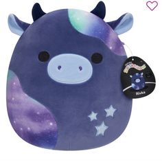 a purple stuffed animal with stars on it's chest and the back of its head