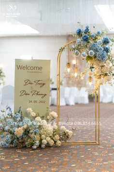 a welcome sign and flowers on display at a wedding