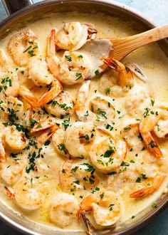 a skillet filled with shrimp and cheese