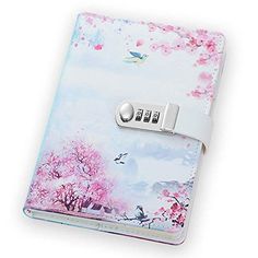 a pink and white notebook with a lock on the cover that is decorated with cherry blossom trees