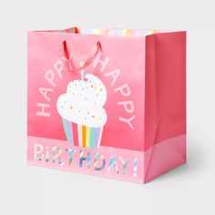 a pink birthday bag with a cupcake on it