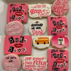 some decorated cookies in a box with writing on them