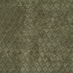 an upholstered green fabric with diamond shapes