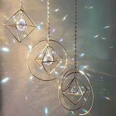 three circular pendants hanging from a chain