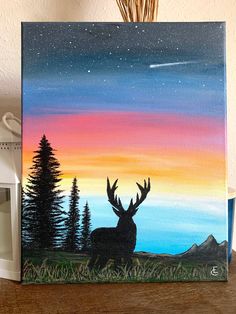 an acrylic painting of a deer at sunset