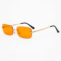 Add some fashionable function to your look with these sunglasses. These sunglasses have rectangle-shaped rimless lenses in super fun orange with red edges. The gold-tone accents add extra style. Frame color: Gold-tone Lens color: Orange Dimensions: 5.5" W x 1.5" H Material: Plastic - Claire's Orange Rectangle Rimless Sunglasses Rectangular Orange Sunglasses With Gradient Lenses, Orange Rectangular Sunglasses With Gradient Lenses, Modern Orange Rectangular Sunglasses, Orange Tinted Sunglasses, Rachel Core, Yellow Lens Sunglasses, Orange Y2k, Orange Glasses, 80s Glasses