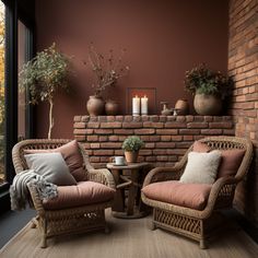 two wicker chairs sitting next to each other in front of a brick fire place