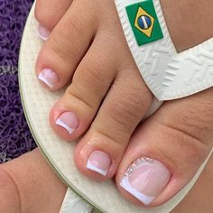 a close up of a person's feet with french manies on top of them