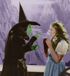 two children dressed up as witches talking to each other