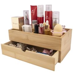 a wooden box with cosmetics and other items in it