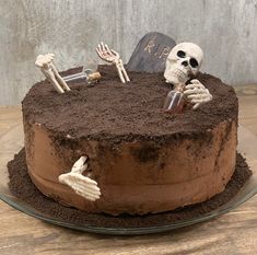 a chocolate cake with skeleton decorations on top