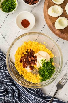 ingredients for deviled eggs in a glass bowl