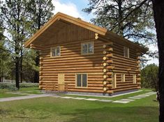 a log cabin is shown in the middle of a grassy area with trees around it