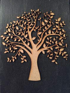 a wooden cutout of a tree with leaves