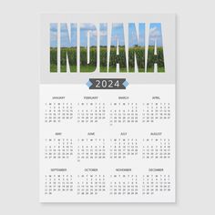 a calendar with the word indiana in blue and white, on top of a gray background