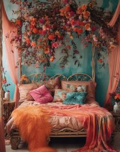 a bed with pink and orange flowers on the headboard, hanging from a canopy over it