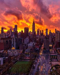 an aerial view of the city at sunset