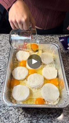 an image of someone cooking eggs and cheese in a pan on the kitchen counter top