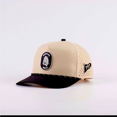 Waterproof 5 Panel Golf Hat. Beige And Black Colorway With A 707 On The Left Side Of The Cap. Beige Snapback Hat With Flat Bill For Outdoor, Brown Sports Visor Snapback Hat, Brown Snapback Sports Hat, Golf Hat, Golf Hats, Beige And Black, Accessories Brand, Golf Accessories, Accessories Branding