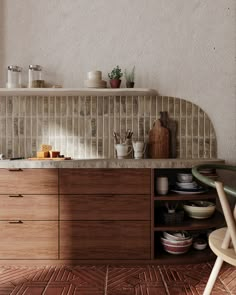 a kitchen with wooden cabinets and tile backsplash