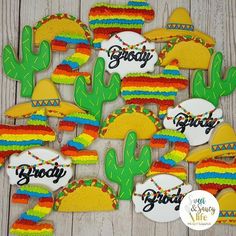 decorated cookies with the words grooy and taco's in rainbow colors