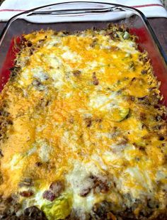 a casserole dish with meat, cheese and vegetables