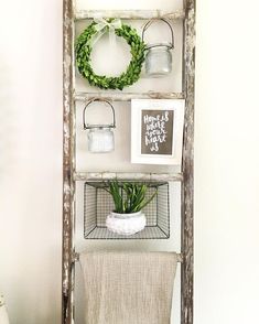 an old ladder is used as a shelf for decor