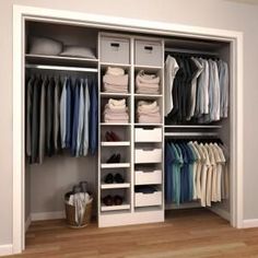 an organized closet with clothes and shoes