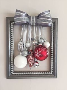 a frame with ornaments hanging from it's sides