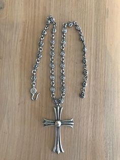 CHROME HEARTS STERLING SILVER LARGE CROSS AND CHAIN.   135grams 21 ½” Fleur cross ball chain. The cross measures 2 1/2" in height and 1 1/2" in width. Stunning, very heavy Chrome Hearts sterling silver cross and chain. This is not just a CH pendant with some other kind of chain attached. Notice the fleur ball crosses on this beautiful Chrome Hearts heavyweight chain. � There is absolutely nothing like this particular piece anywhere. Chrome Hearts Chain, Chrome Hearts Necklace, Jacket Men Style, Chrome Hearts Jewelry, Leather Jacket Men Style, Hearts Necklace, Cross Chain, Heart Chain, Rosary Beads